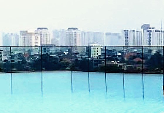City skyline photographed across still water.
